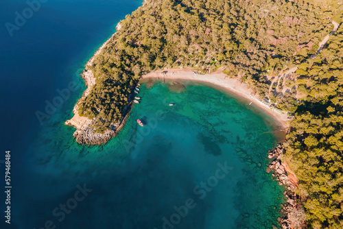 Beach in beautiful lagoon of Aegean sea in Turkey, aerial wide shot