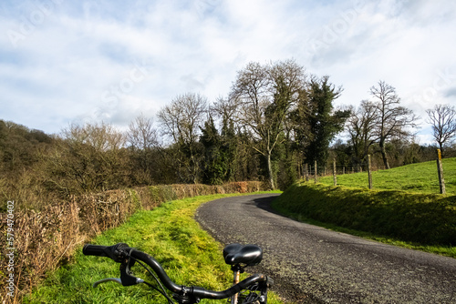 Road in countryside with turning and bike standing. Active rest, cycling.