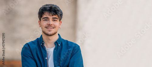 portrait of smiling pre-adult young man photo