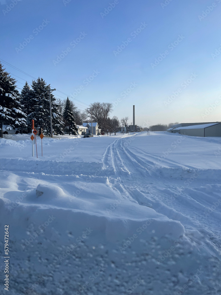 houses covered in snow after midwest blizzard