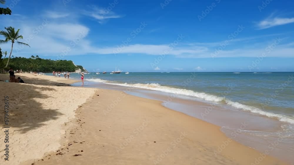 Walking on Praia Do Espelho beach, a famous tourist destination of Caraiva, the coast of the Brazilian northeast. Porto Seguro - Bahia, Brazil. Walking on Praia Do Espelho beach, a famous tourist destination of Caraiva, the coast of the Brazilian northeast. Porto Seguro - Bahia, Brazil.