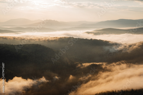 Mountain landscape, morning sun fog in the mountains, smoke filled the lowlands of the river, golden dawn, beauty of nature, Russia, taiga, Southern Urals Bashkortostan