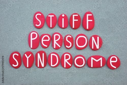 Stiff person syndrome, sps, rare, progressive neurological disorder, text composed with red painted stone letters over green sand