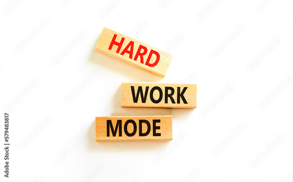 Hard work mode symbol. Concept words Hard work mode on wooden block on a beautiful white table white background. Business and Hard work mode concept. Copy space. Hard work mode symbol. Concept words Hard work mode on wooden block on a beautiful white table white background. Business and Hard work mode concept. Copy space.