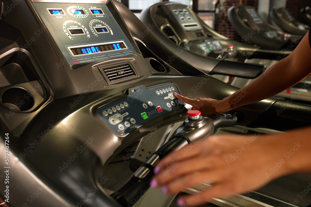 I am ready to workout Close up photo of woman hand pushing a start button on treadmill at gym. Cardio workout I am ready to workout Close up photo of woman hand pushing a start button on treadmill at gym. Cardio workout