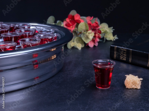 Taking communion the wine and the bread symbols on black background