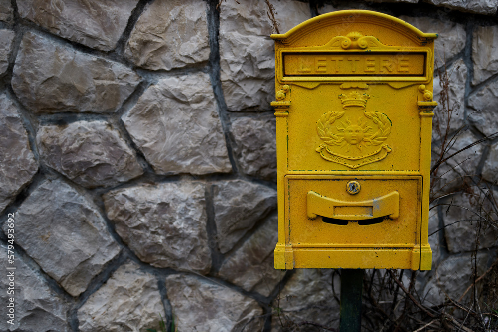 Old yellow mailbox in Montenegro