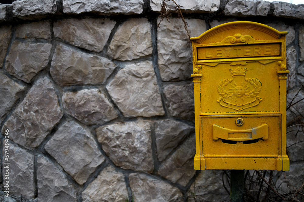 Old yellow mailbox in Montenegro Old yellow mailbox in Montenegro
