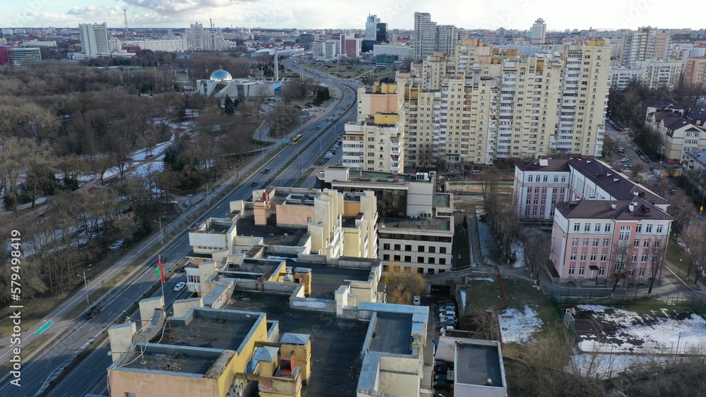 Multi-storey residential building in the center of Minsk and a panorama of the metropolis from a drone from a height. Panoramic view of autumn and spring Minsk, the capital of Belarus