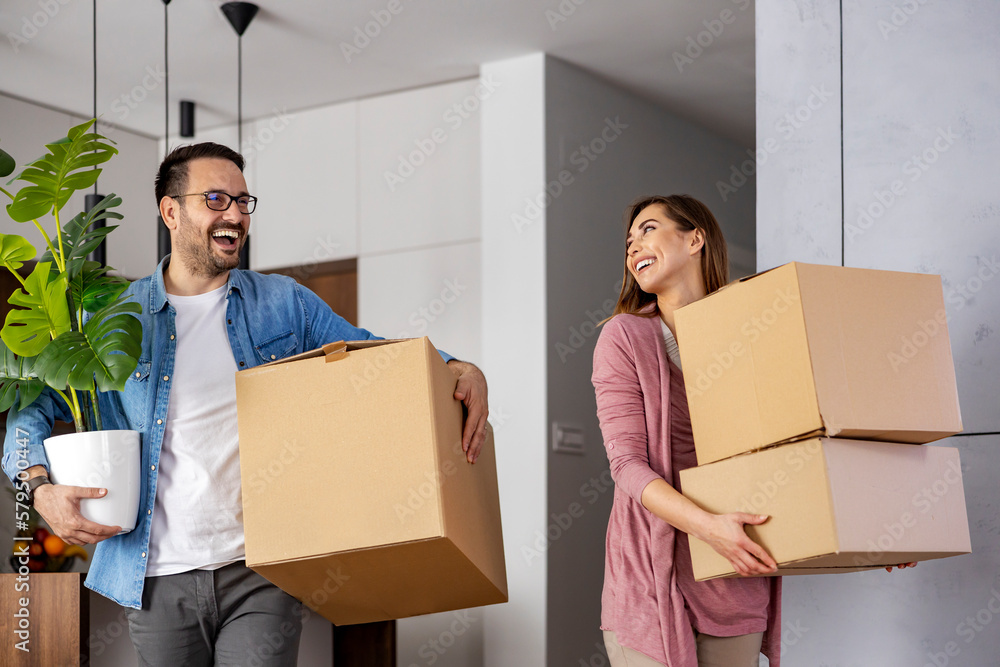 Happy family with cardboard boxes in new house Happy family with cardboard boxes in new house