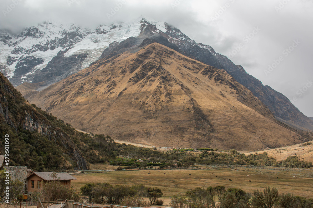 Fototapeta premium View of the mountain and the glacier Salcantay, with incredible clouds, from the city of Soray, in Peru. 