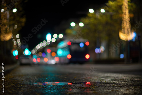 Blurred footage of transport. Blur of city lights along the road, light out of focus at night. Night city traffic, beautiful background.