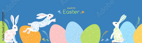 Happy Easter greeting graphic flat design with white rabbits jumping at pastel colored easter eggs. Egg hunting. Floral ornament. great for horizontal Easter Card, banner, flyer, poster, wallpapers