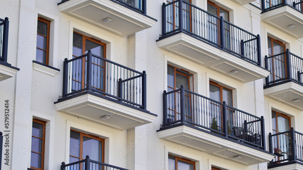 Fototapeta premium Modern architecture building facade with balconies. New apartments. Contemporary apartment building.