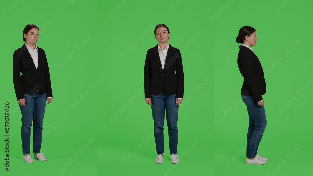Obraz premium Full body green screen backdrop of business woman, posing on camera. Female office employee in suit standing over greenscreen background, being confident and optimistic company worker.