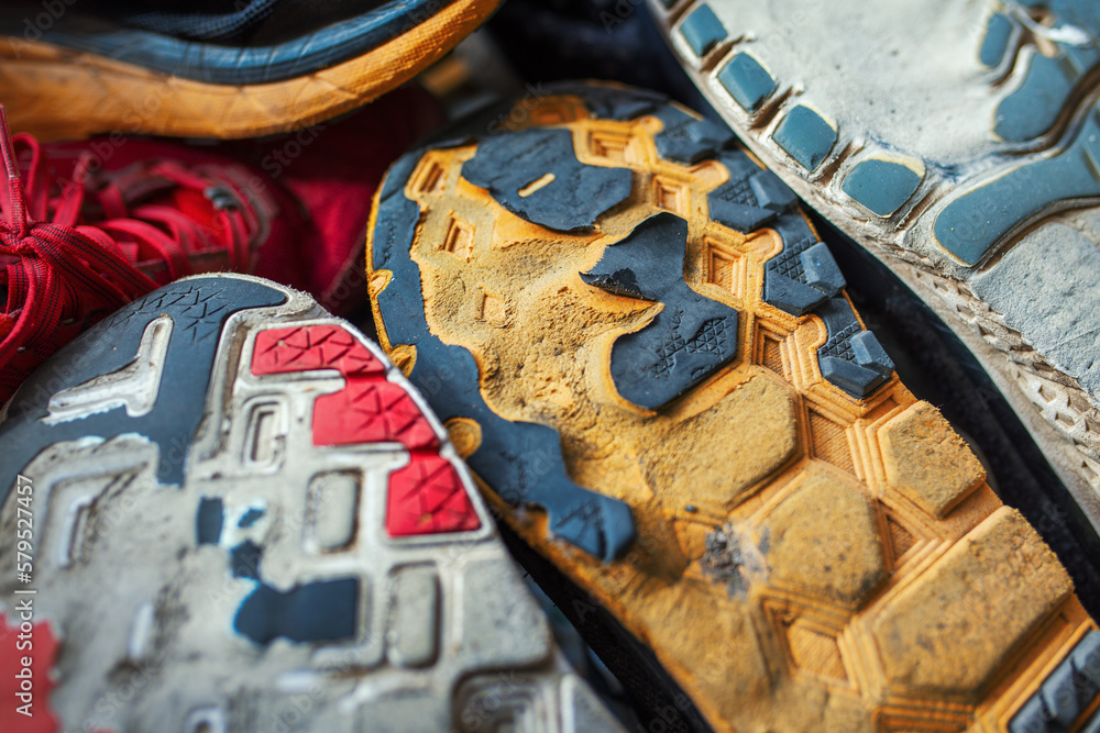 Worn soles of a running shoes from which the excess supination