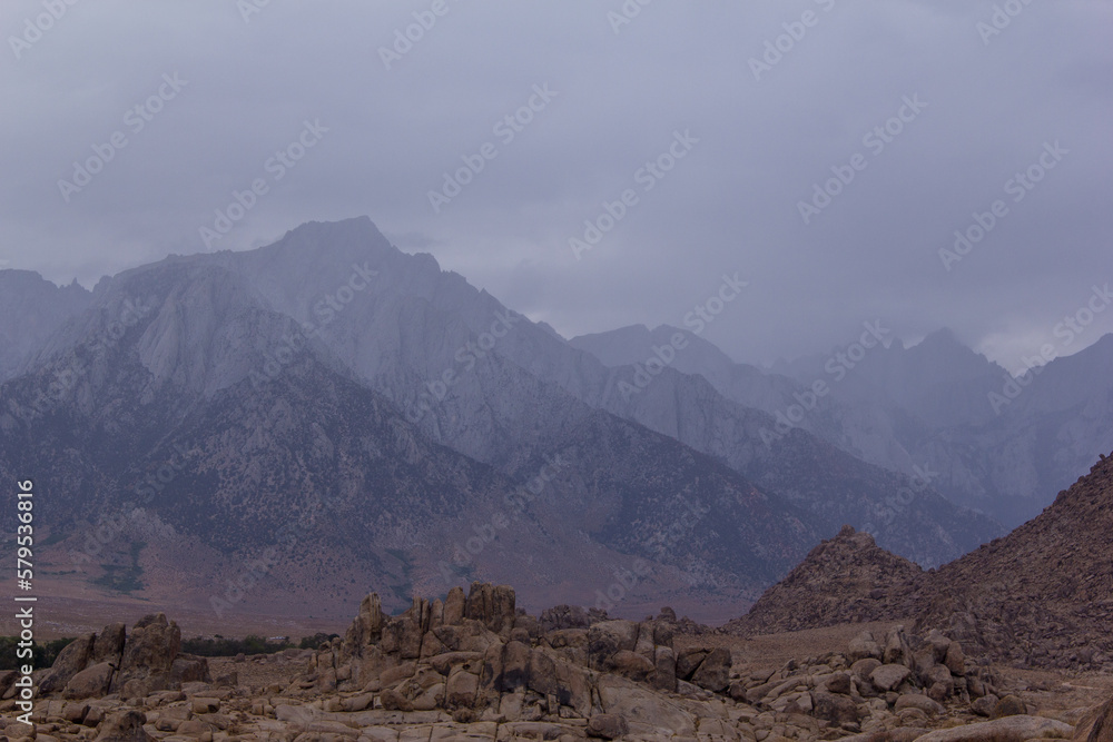 storm clouds roll through the eastern Sierra Nevada mountains and the Alabama hills, near lone pine, California