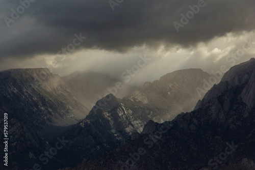 Sun beams shine down on the Sierra Nevada Mountains in California. view from the Alabama hills looking towards Whitney Portal
