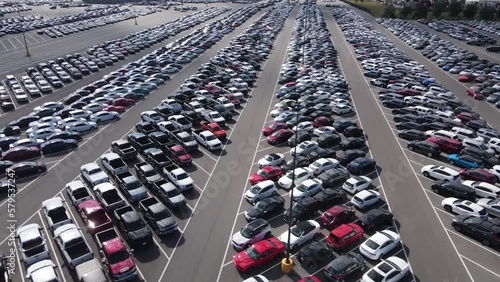 Aerial view of a parking lot full of used cars.