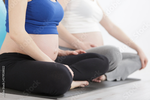 group of pregnant women relaxing at home