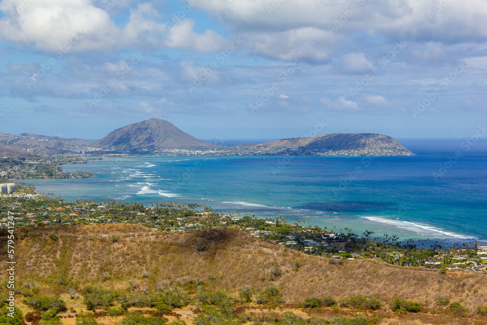 View of the city of Honolulu from above at the top of Diamond Head Crater, in Oahu, Hawaii. Sail boats and buildings. View of the city of Honolulu from above at the top of Diamond Head Crater, in Oahu, Hawaii. Sail boats and buildings.