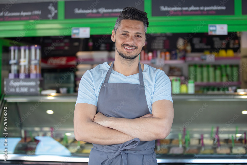 Fototapeta premium portrait of waiter in an ice-cream parlour