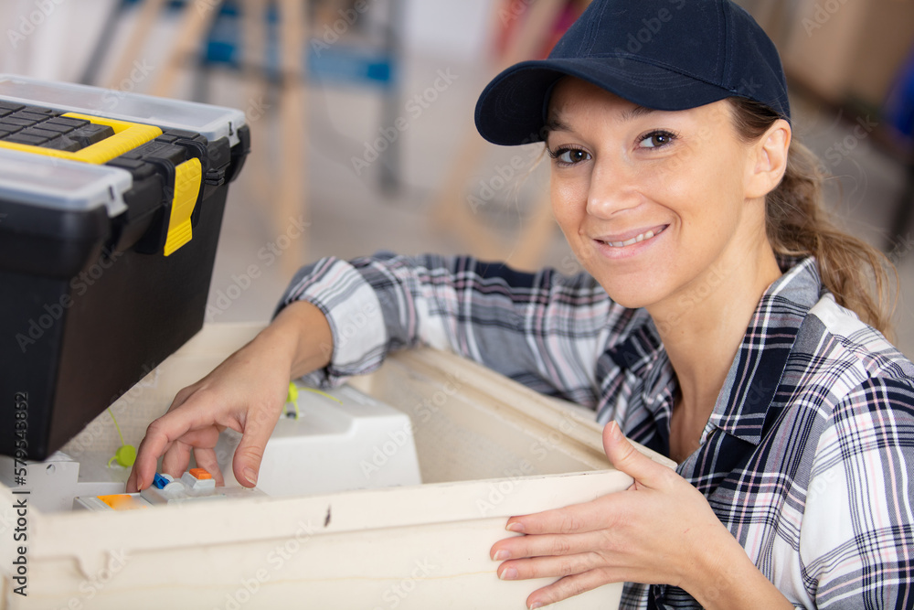 female electrician preparing power meter female electrician preparing power meter