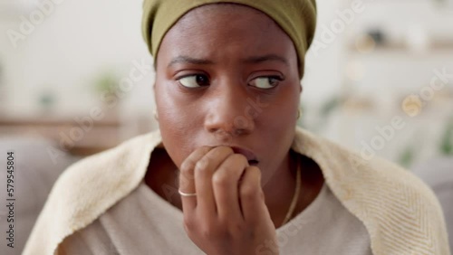 Black woman, face and anxiety with stress and mental health, worried and biting nails, depression and need help. Fear, nervous and worried with female at home, psychology and healthcare with crisis photo