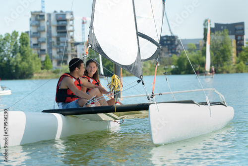 young couple on sailing boat