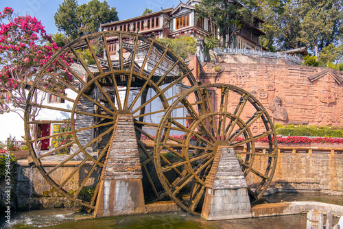 Scenic buiding in the Old Town of Lijiang. Lijiang is a popular tourist destination of China, Asia. Wheel