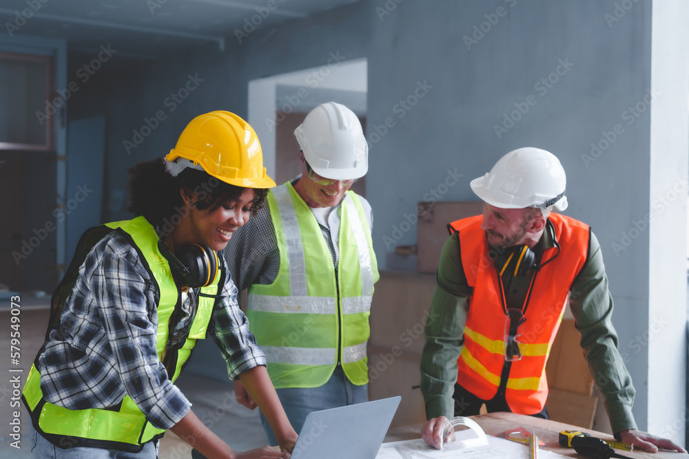 Group of multi ethnic engineer construction site worker meeting at workplace, Architects working together at construction site to remodeling home or building. Group of multi ethnic engineer construction site worker meeting at workplace, Architects working together at construction site to remodeling home or building.