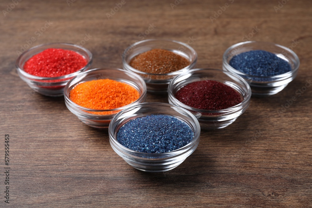 Many different food coloring on wooden table Many different food coloring on wooden table