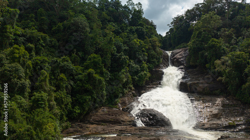 Jungle Waterfall in a tropical forest surrounded by green vegetation. Bopath Falls in mountain jungle. Sri Lanka. photo