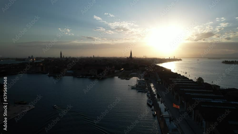 Sun Rises Above Venice Island, Italy, Bridge and Calm Blue Sea of Italian City of Canals, Aerial Drone Flying above Idyllic Venetian Lagoon, Sailing Boats Sun Rises Above Venice Island, Italy, Bridge and Calm Blue Sea of Italian City of Canals, Aerial Drone Flying above Idyllic Venetian Lagoon, Sailing Boats