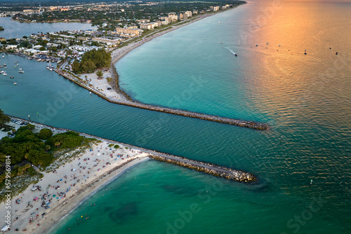 Aerial evening seascape with Nokomis sandy beach in Sarasota County, USA. Many tourists enjoing summer vacation time swimming in warm Mexico gulf water and sunbathing on hot Florida sun photo