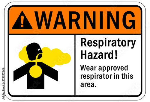 Inhalation hazard sign and labels wear approved respirator in this area
