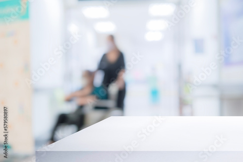 White table in modern hospital interior with empty copy space on the table for product display mockup.