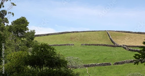 Vast Hilly Field With Border Walls At Parque Das Frechas In Agualva, Terceira Island, Portugal. wide photo