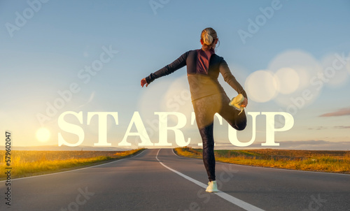 A woman on the road does a warm-up before the start. The concept of starting a new business.