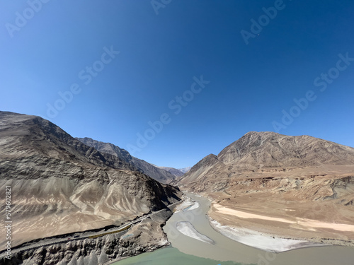 Sangam, Confluence of Zanskar and Indus river near Leh Ladakh, India shows its 2 color during summer time