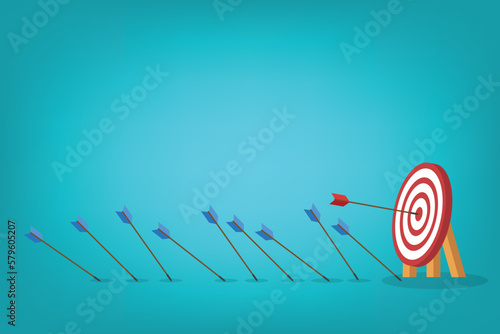 Business challenge failure and success concept. Blue arrows missed hitting target and only red one hits the center.