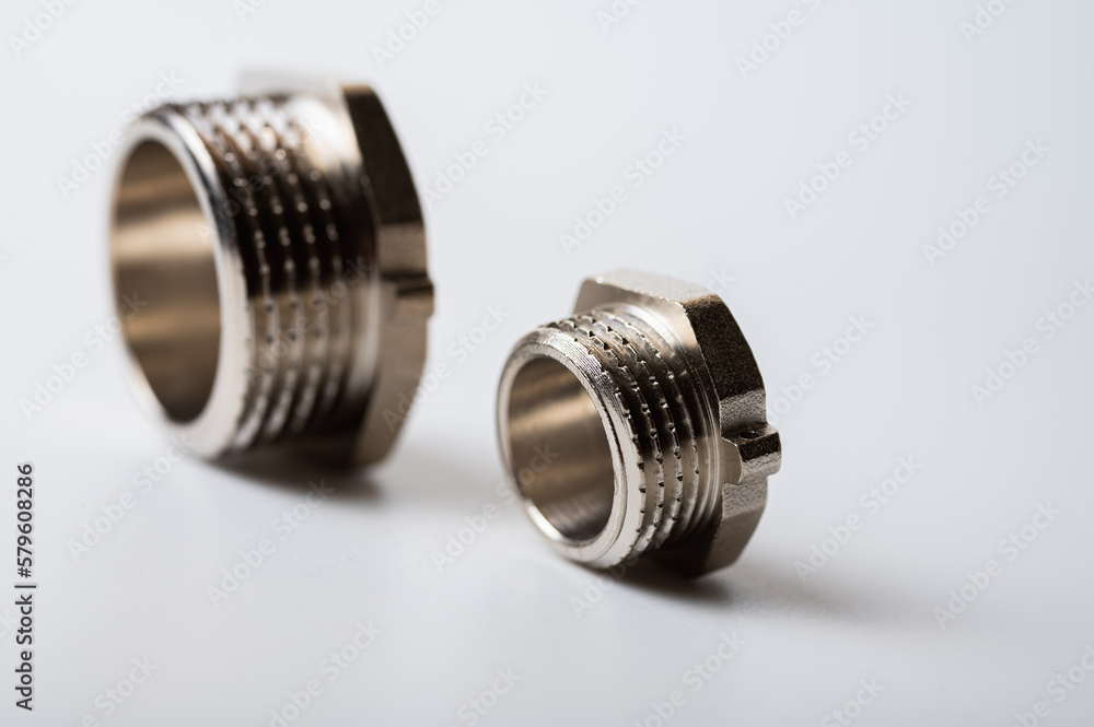 brass metal tee water adapters isolated on light background close up plumbing connections and details brass metal tee water adapters isolated on light background close up plumbing connections and details