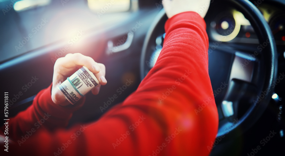 Concept background. dollars with a car key lie in inside cars. financial concept Concept background. dollars with a car key lie in inside cars. financial concept