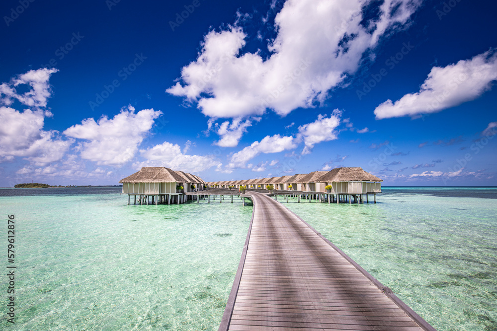 Maldives paradise island. Tropical aerial landscape, seascape with jetty, water bungalows villas with amazing sea lagoon beach. Exotic tourism destination, summer vacation background. Aerial travel
