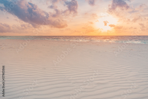 Fototapeta Naklejka Na Ścianę i Meble -  Closeup of sand on beach and dreamy summer sky. Panoramic beach landscape. Empty tropical beach and seascape. Orange and golden sunset sky, soft sand, calmness, tranquil relaxing sunlight, summer mood