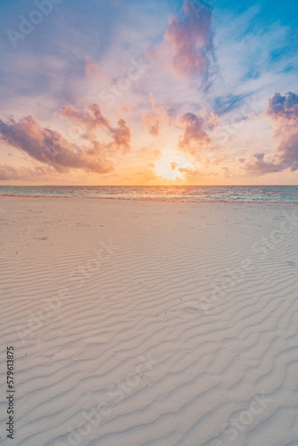 Closeup of sand on beach and dreamy summer sky. Panoramic beach landscape. Empty tropical beach and seascape. Orange and golden sunset sky  soft sand  calmness  tranquil relaxing sunlight  summer mood