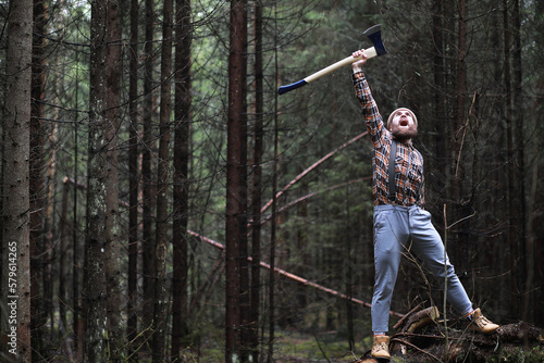 A bearded lumberjack with a large ax © alexkich