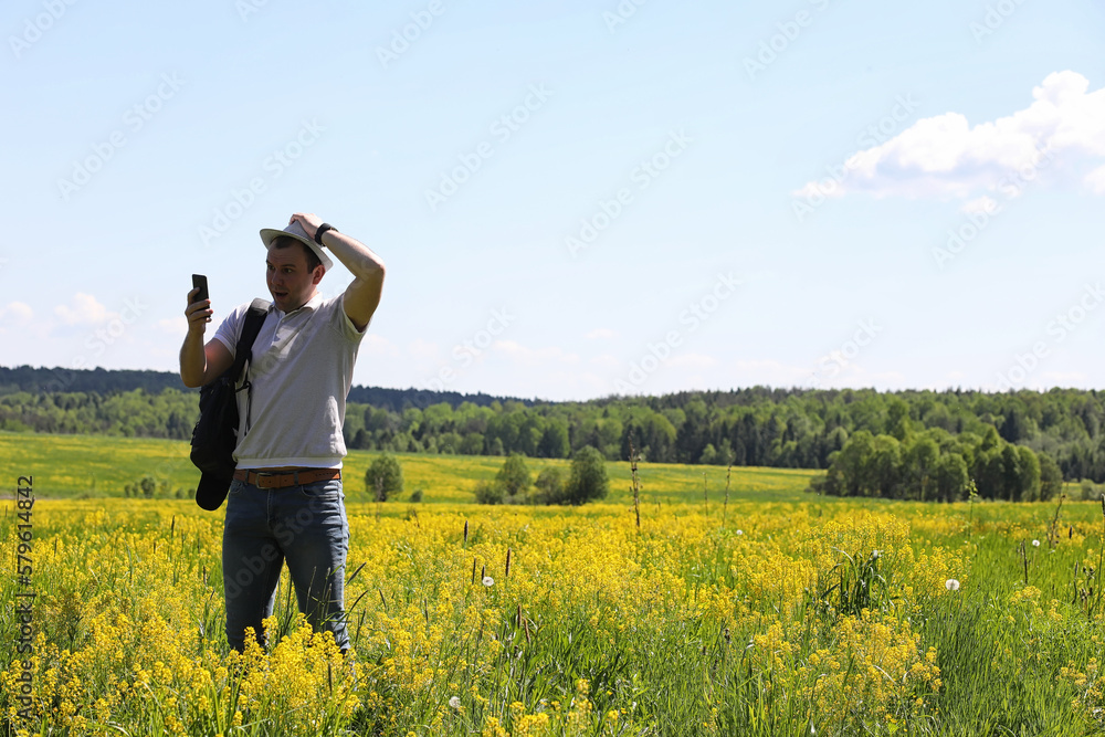Young man travels with a backpack Young man travels with a backpack