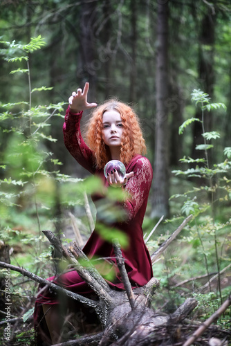 Witch holds a ritual sphere