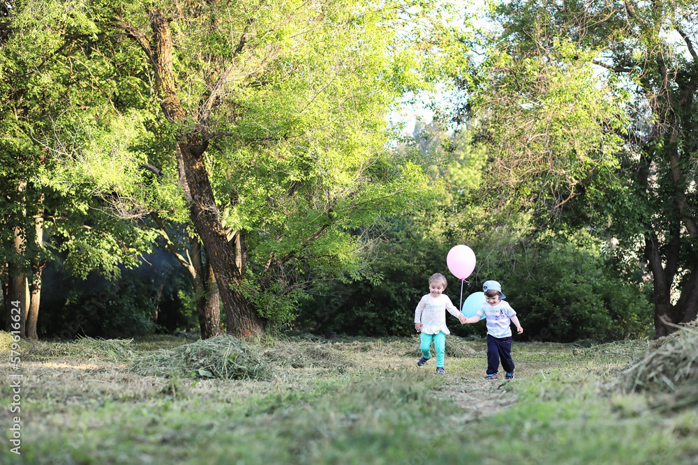 Little children are walking in a park Little children are walking in a park